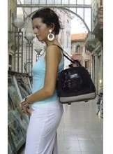 woman wearing small dog carrier